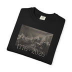 Folded Black Comfort Colors t-shirt with a printed design of Trumbull's  'Declaration of Independence' painting with '1776-2026' in overlapping revolutionary era text