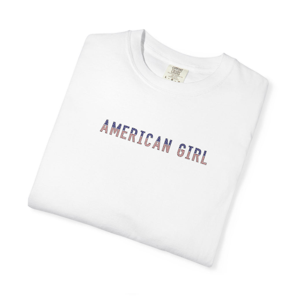 Folded white t-shirt with 'American Girl' in patriotic stars & stripes text