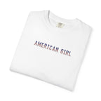 Folded white t-shirt with 'American Girl' in patriotic stars & stripes text