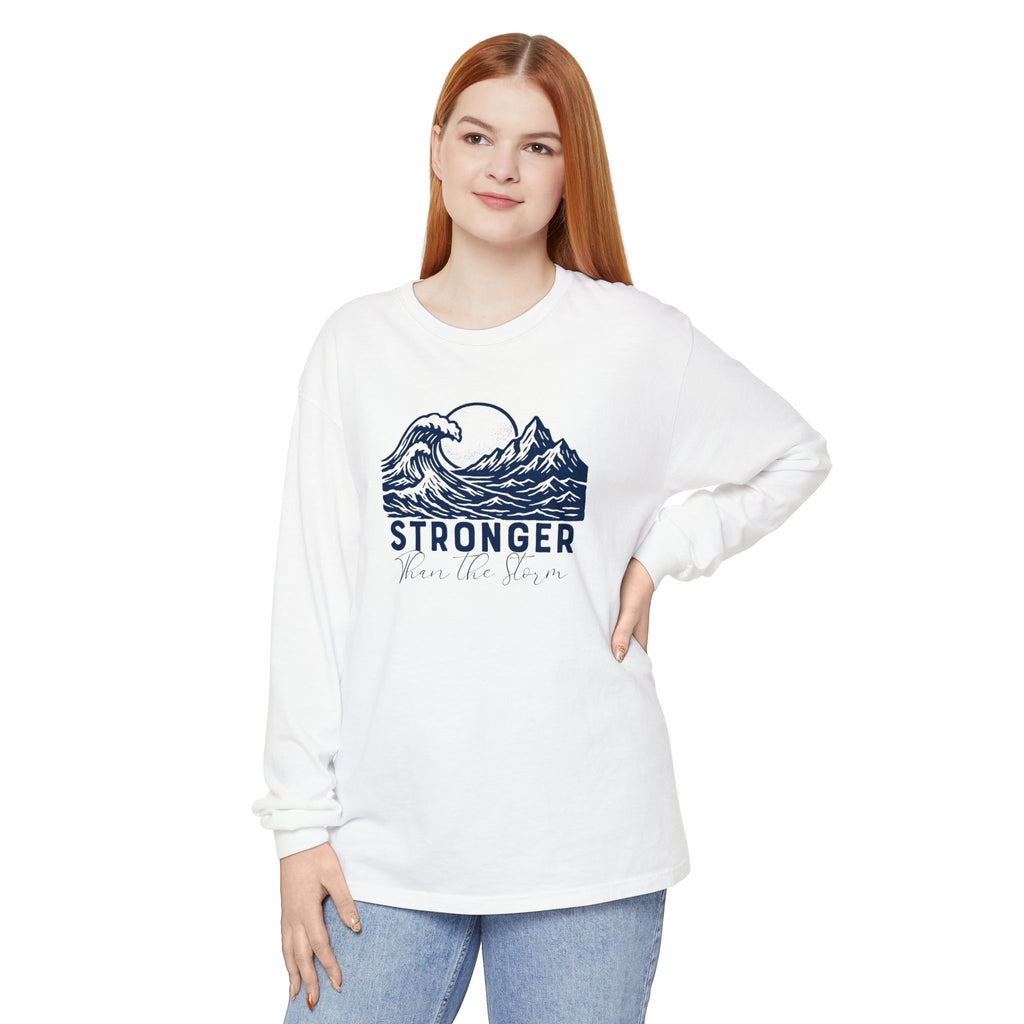 Person wearing Stronger Than The Storm faith long sleeve t-shirt in white