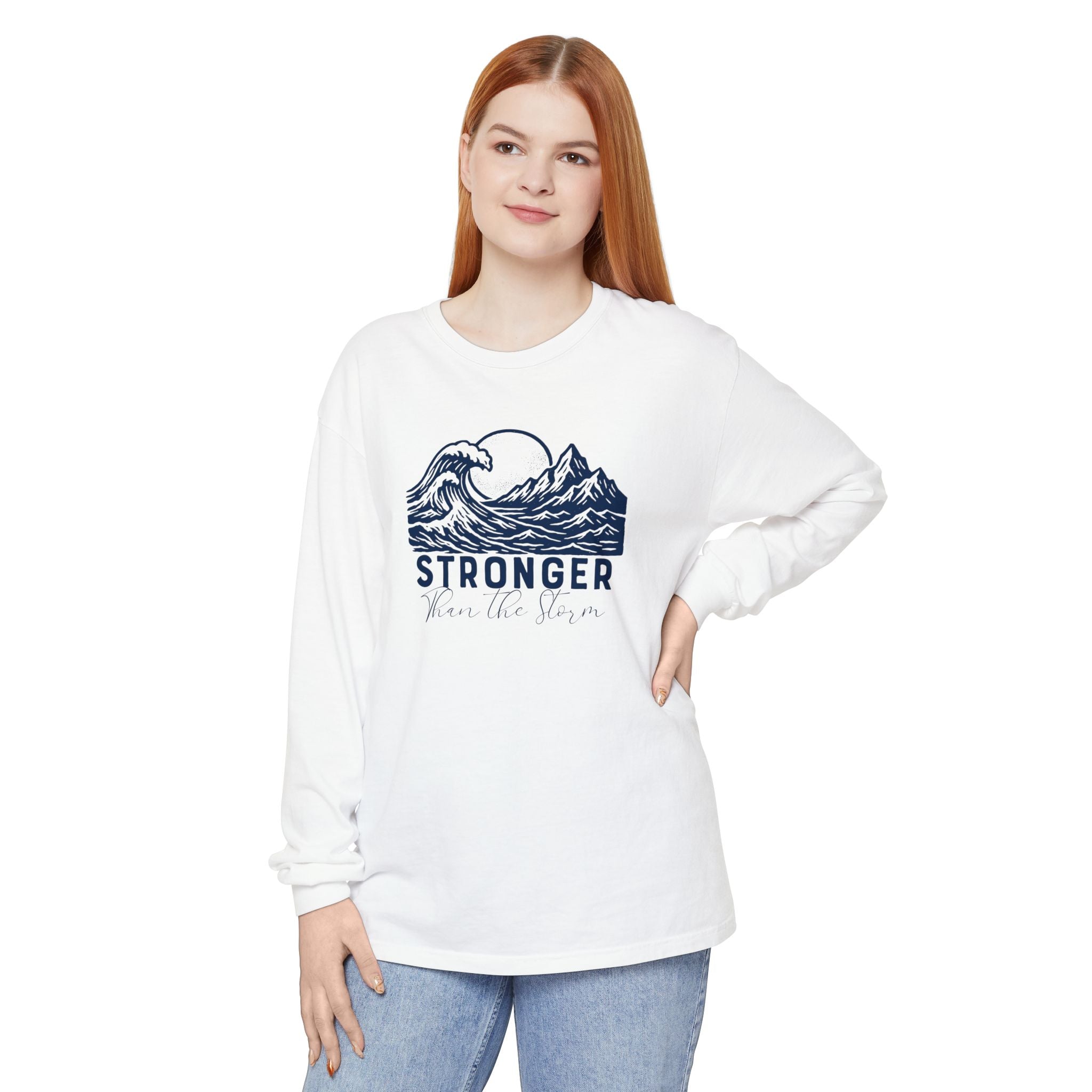 Person wearing Stronger Than The Storm faith long sleeve t-shirt in white