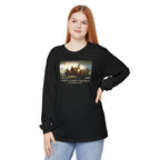 Woman wearing a long-sleeve Black Comfort Colors t-shirt with Leutze's 'Washington Crossing the Delaware' with 'America's First Christmas December 25, 1776 printed underneath