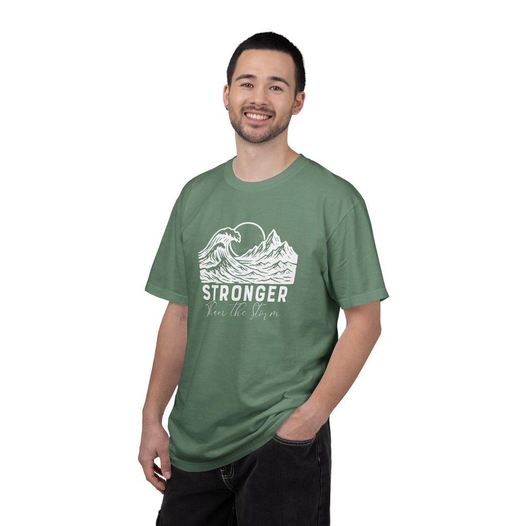 Man wearing Stronger Than The Storm faith t-shirt in light green