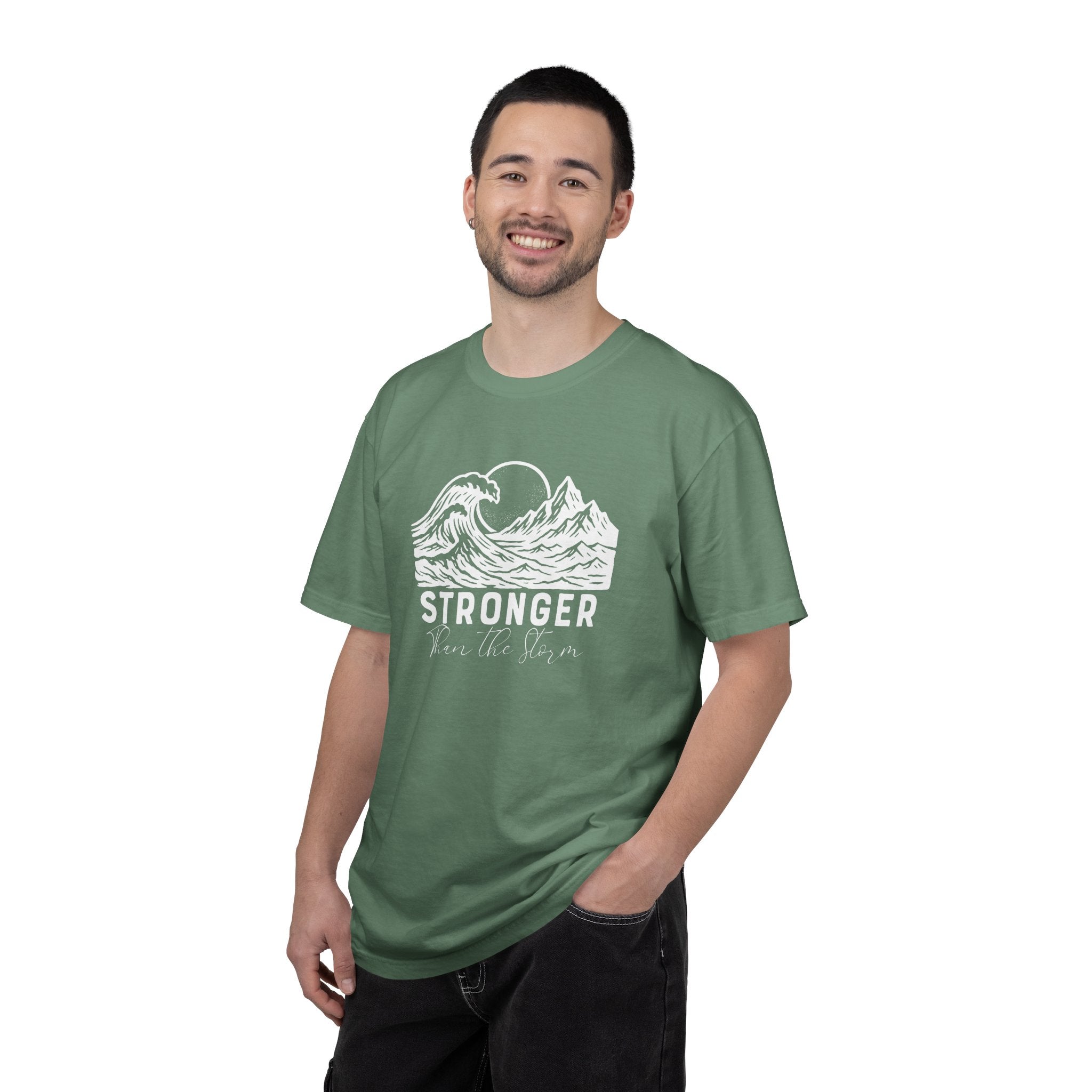 Man wearing Stronger Than The Storm faith t-shirt in light green
