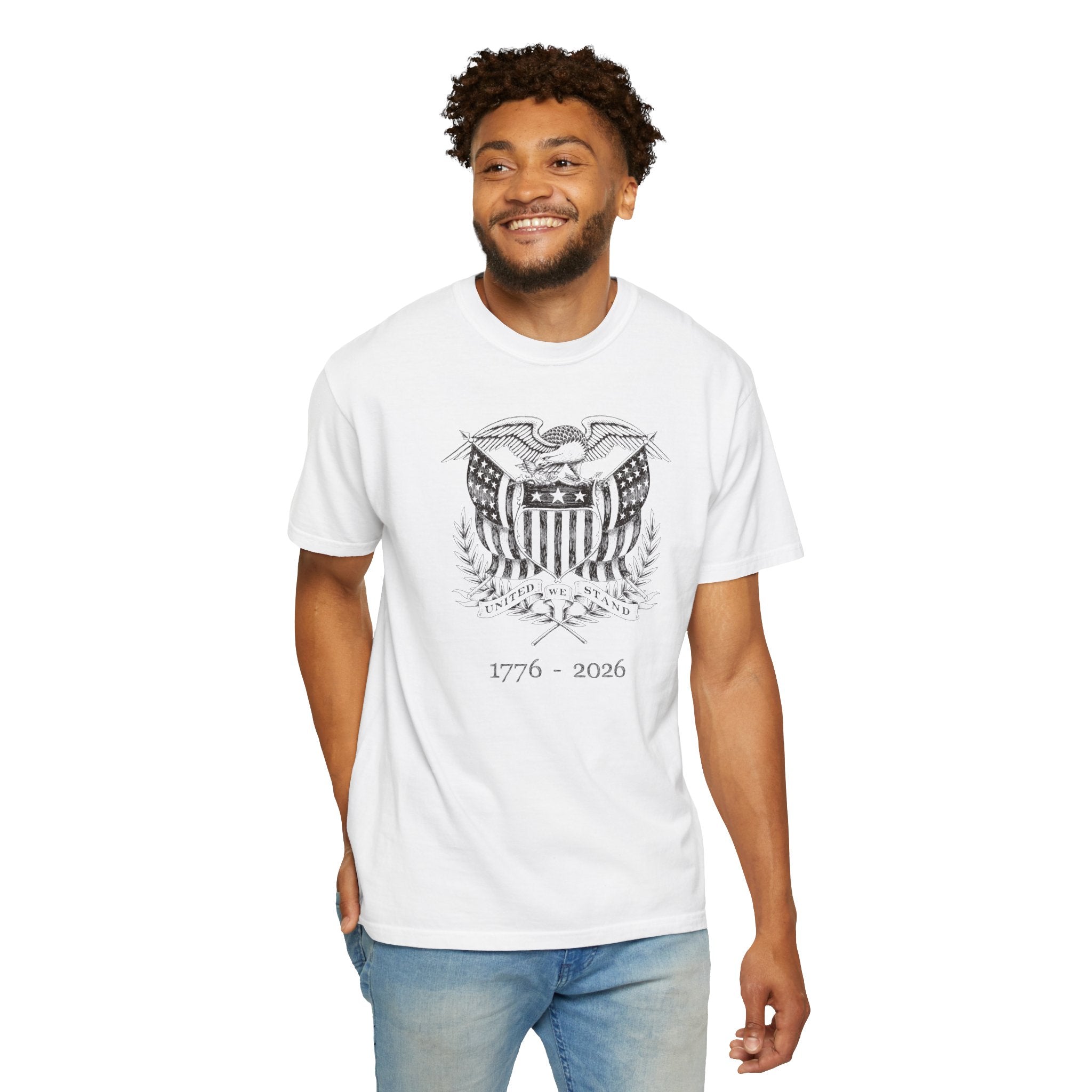 Smiling man wearing a white United We Stand eagle t-shirt
