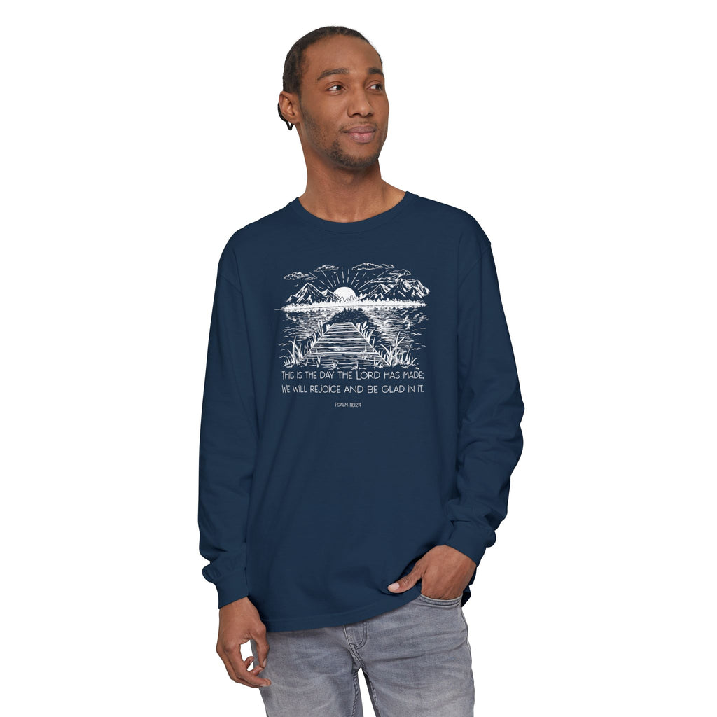 Man wearing a long-sleeve True Navy Comfort Colors t-shirt featuring Psalm 118:24 paired with a nature graphic 