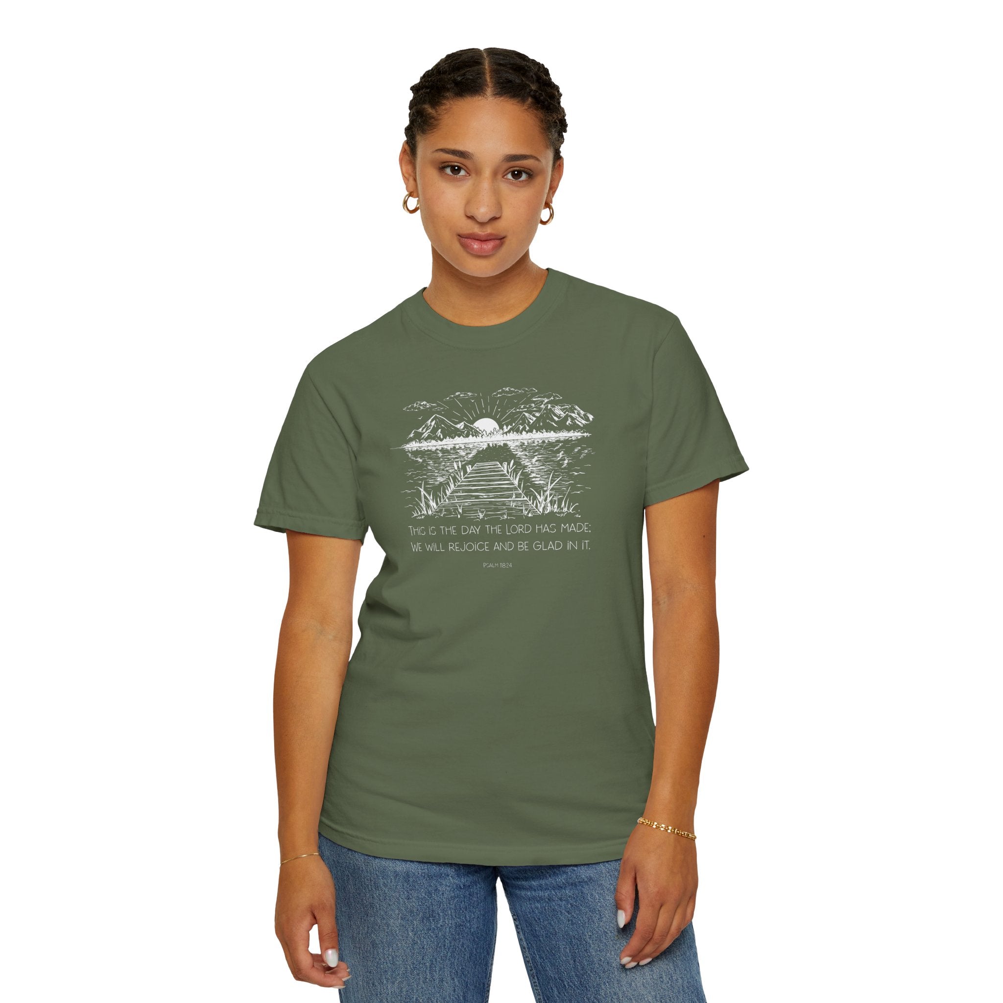 Woman wearing Sage Comfort Colors t-shirt with nature graphic and 'This is the day the Lord has made; We will rejoice and be glad in it' below
