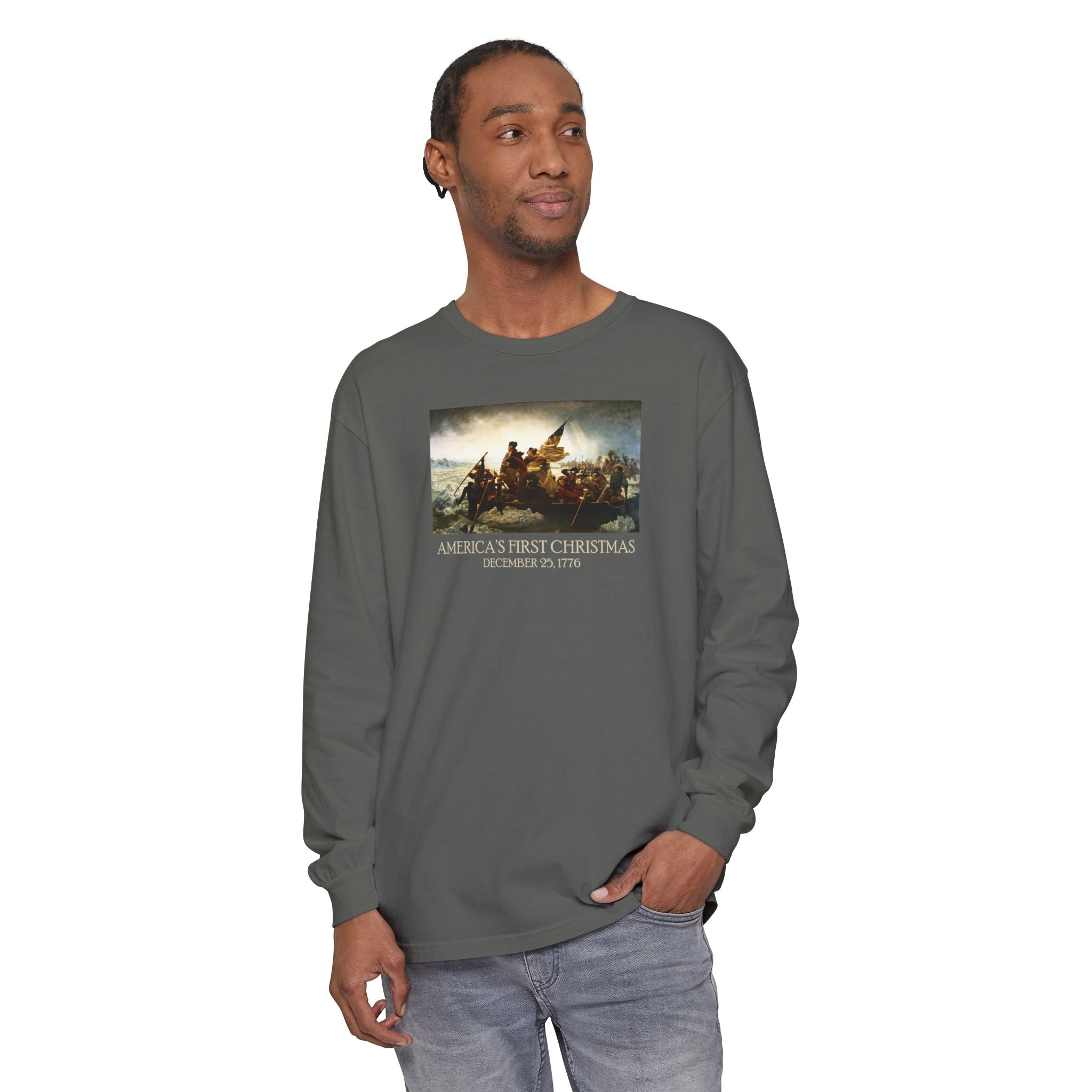 Man wearing a long-sleeve Pepper Comfort Colors t-shirt with Leutze's 'Washington Crossing the Delaware' with 'America's First Christmas December 25, 1776 printed below