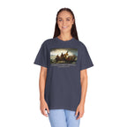 Woman wearing an oversized Denim Comfort Colors t-shirt with print of Emanuel Leutze’s 'Washington Crossing the Delaware' with 'America's First Christmas December 25, 1776' printed below 