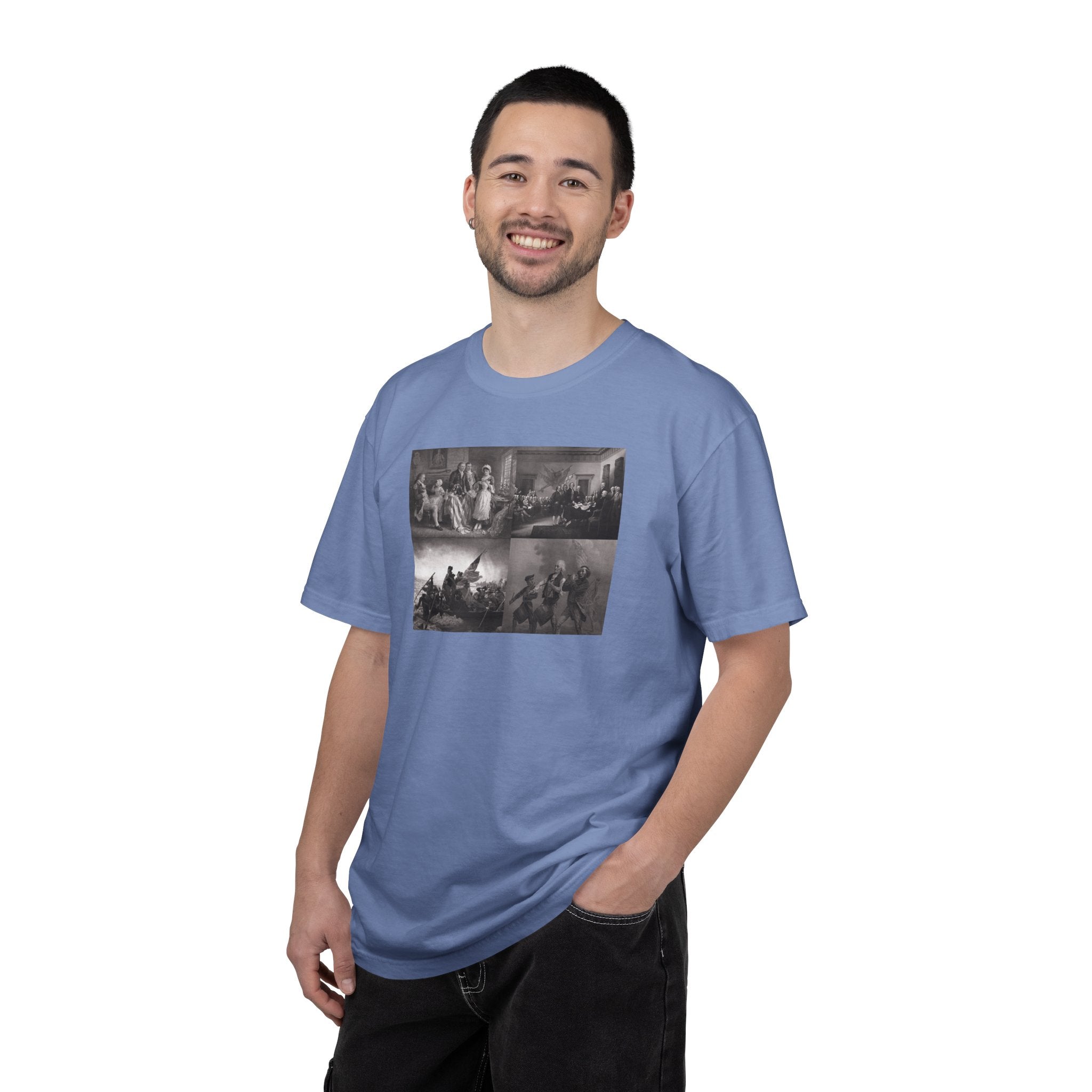 Man wearing a Washed Denim Comfort Colors t-shirt printed with a montage of four revolutionary war era paintings