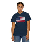 Woman wearing a True Navy Comfort Colors t-shirt with distressed American flag graphic and 'They Walked Into the Wrong Republic' quote from Entheos