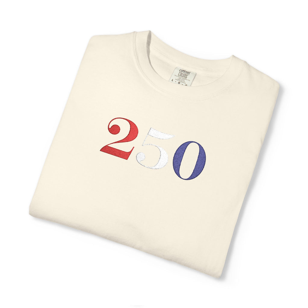Folded ivory-colored t-shirt with '250' embroidered in red, white, and blue