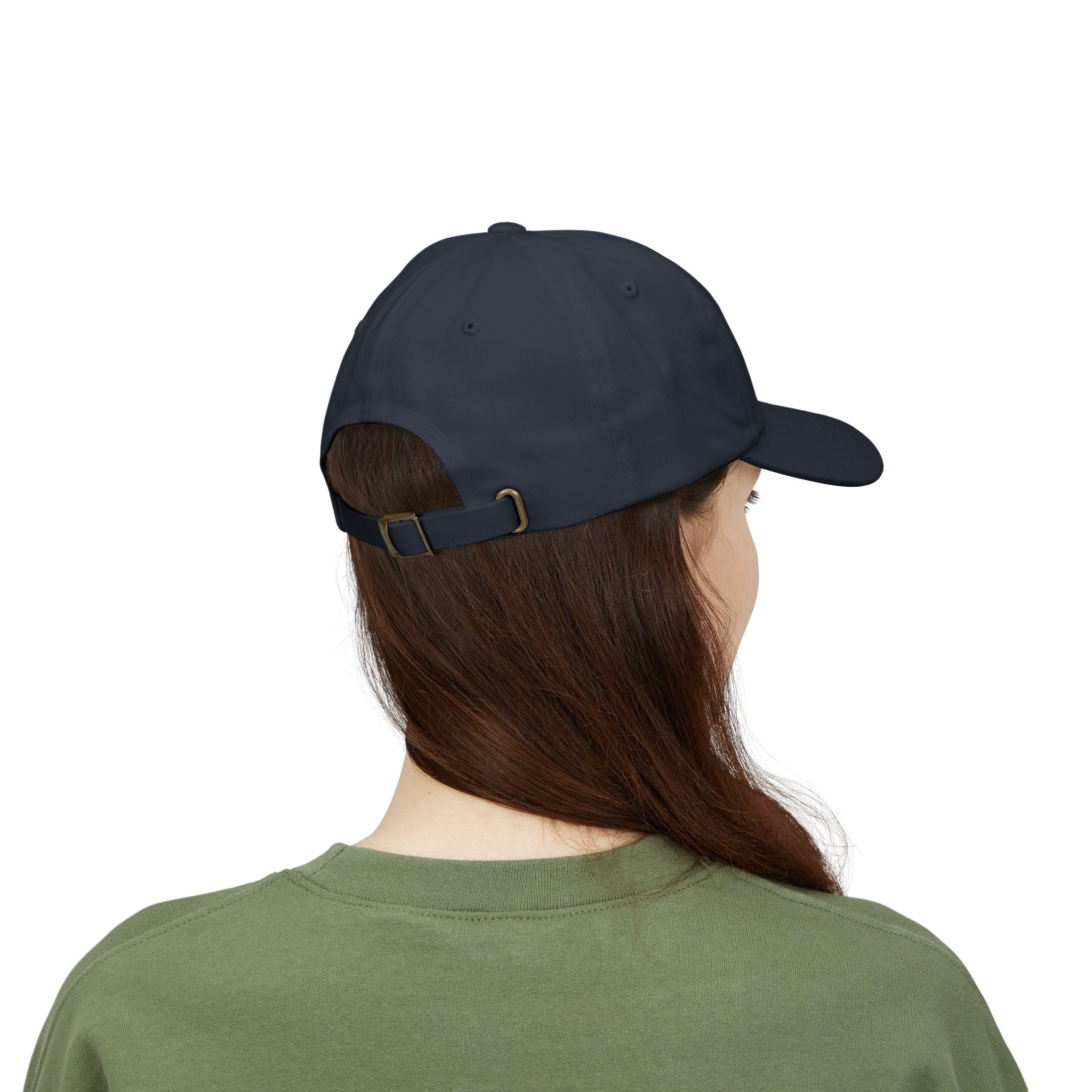 Back view of a woman wearing a navy blue cap 