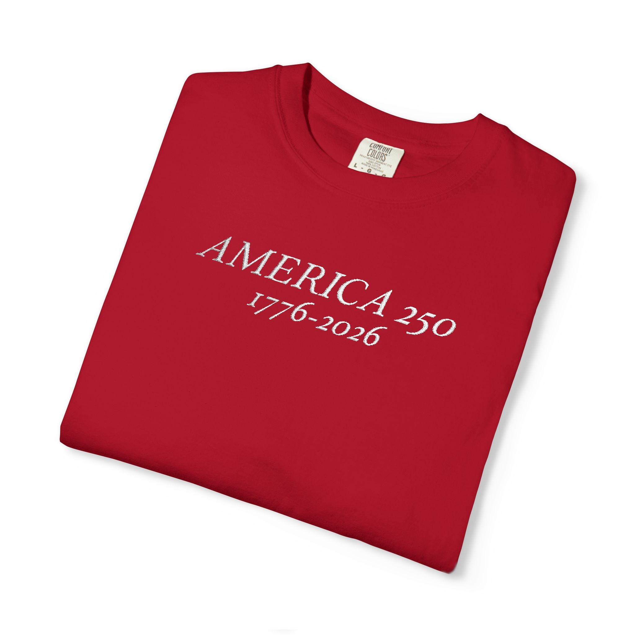 Folded Red Comfort Colors t-shirt with 'AMERICA 250 1776-2026' embroidered in white thread