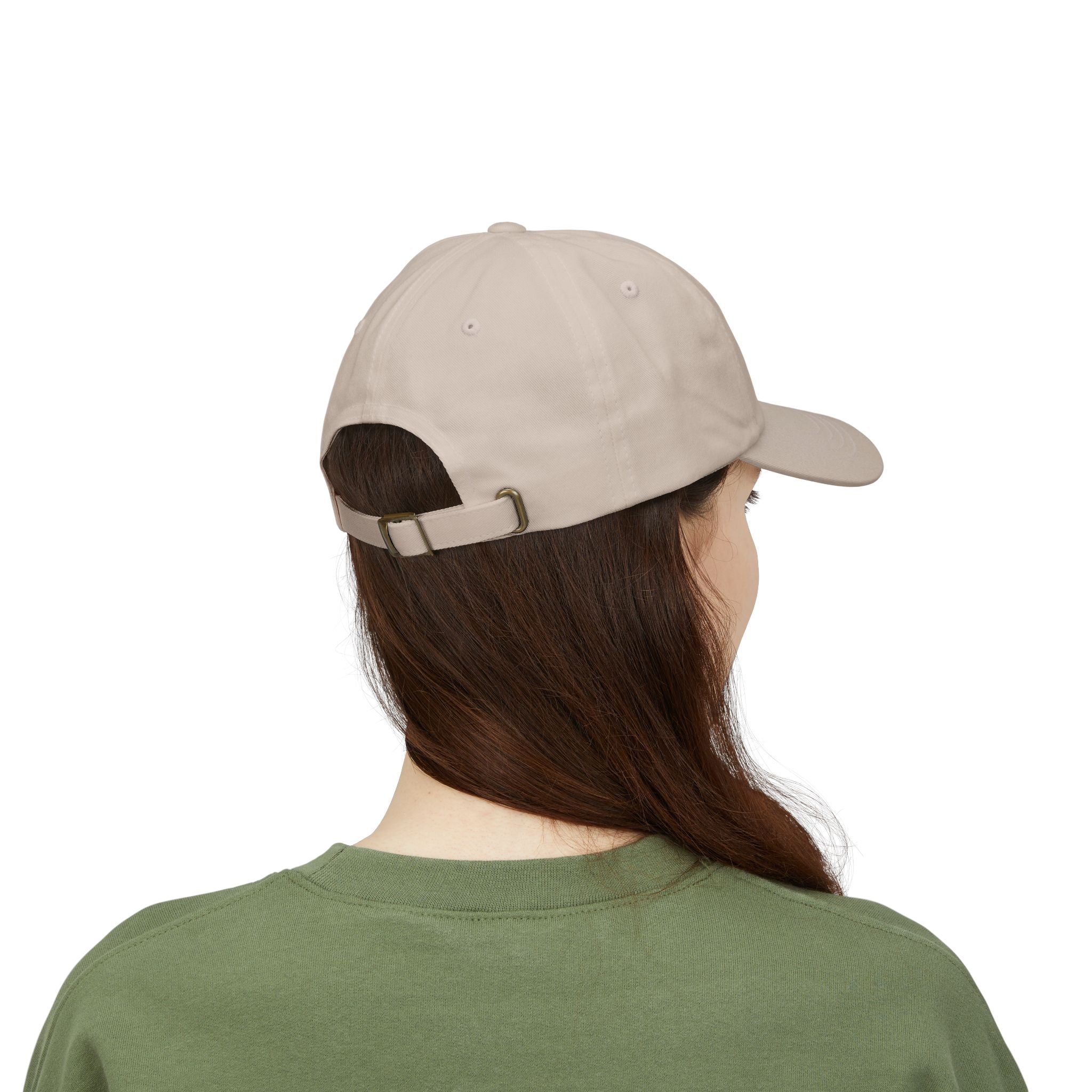 Back view of a woman wearing a stone-colored baseball cap