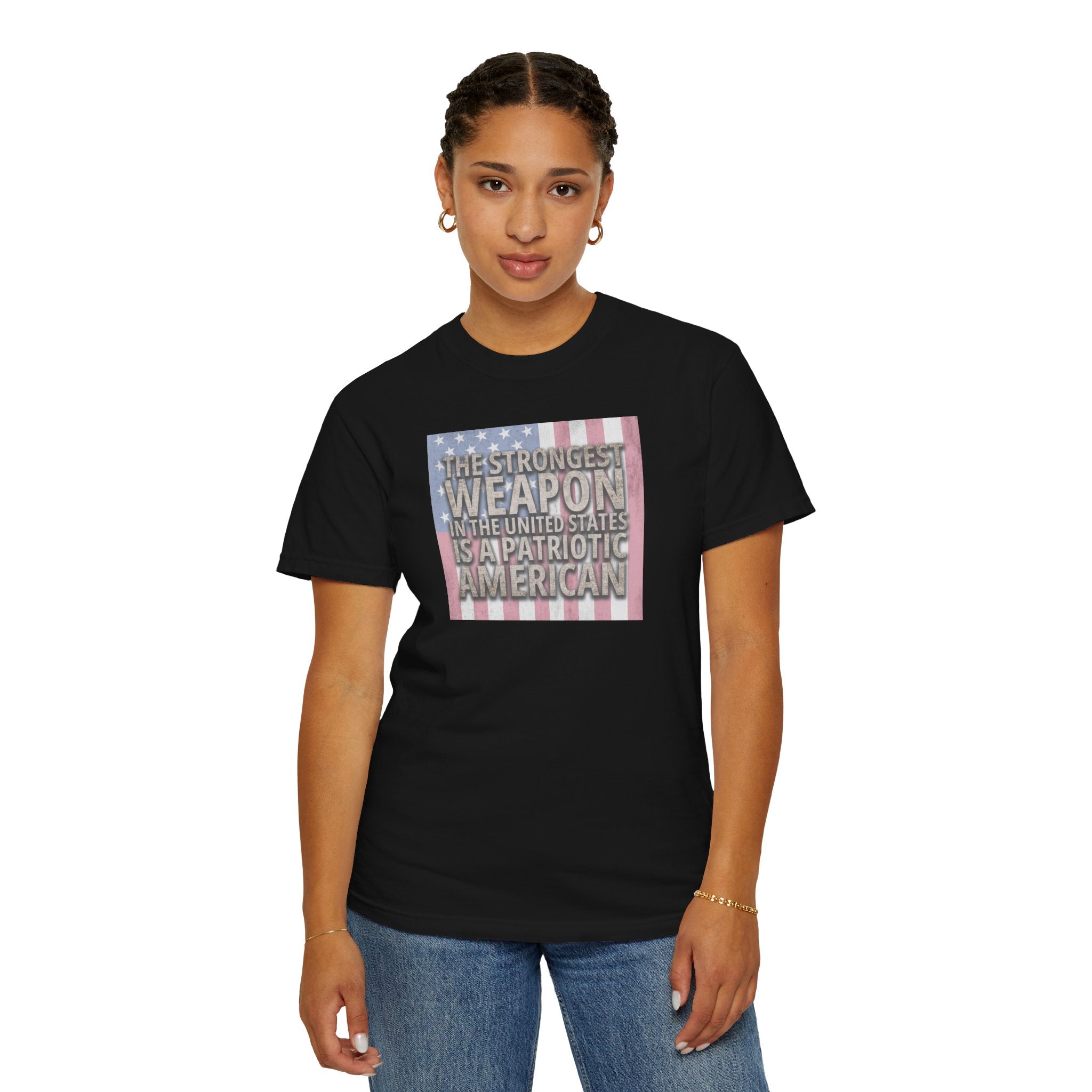 woman wearing 'The Strongest Weapon in the United States is a Patriotic American' t-shirt in black