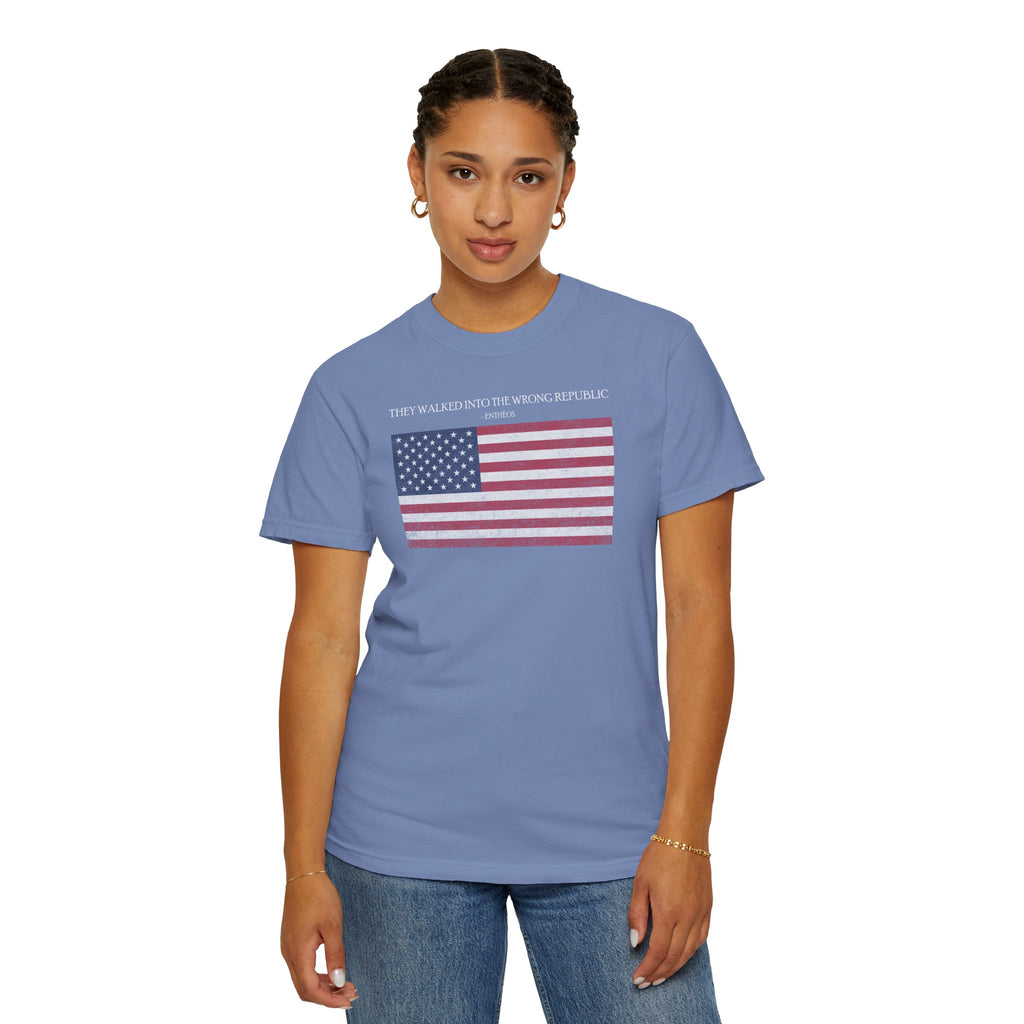 Woman wearing a Washed Denim Comfort Colors t-shirt with distressed American flag graphic and 'They Walked Into the Wrong Republic' quote from Entheos
