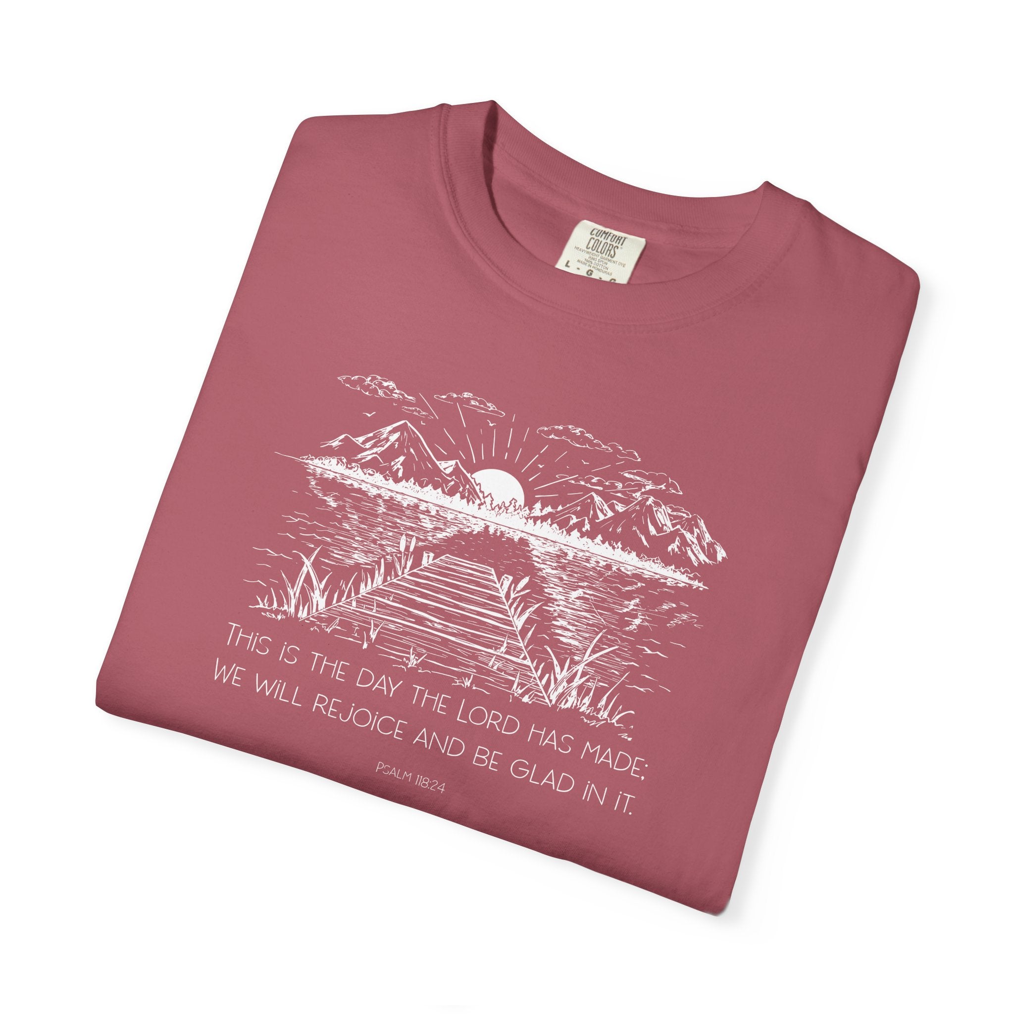 Folded Crimson Comfort Colors t-shirt with nature graphic and Psalm 118:24 beneath it