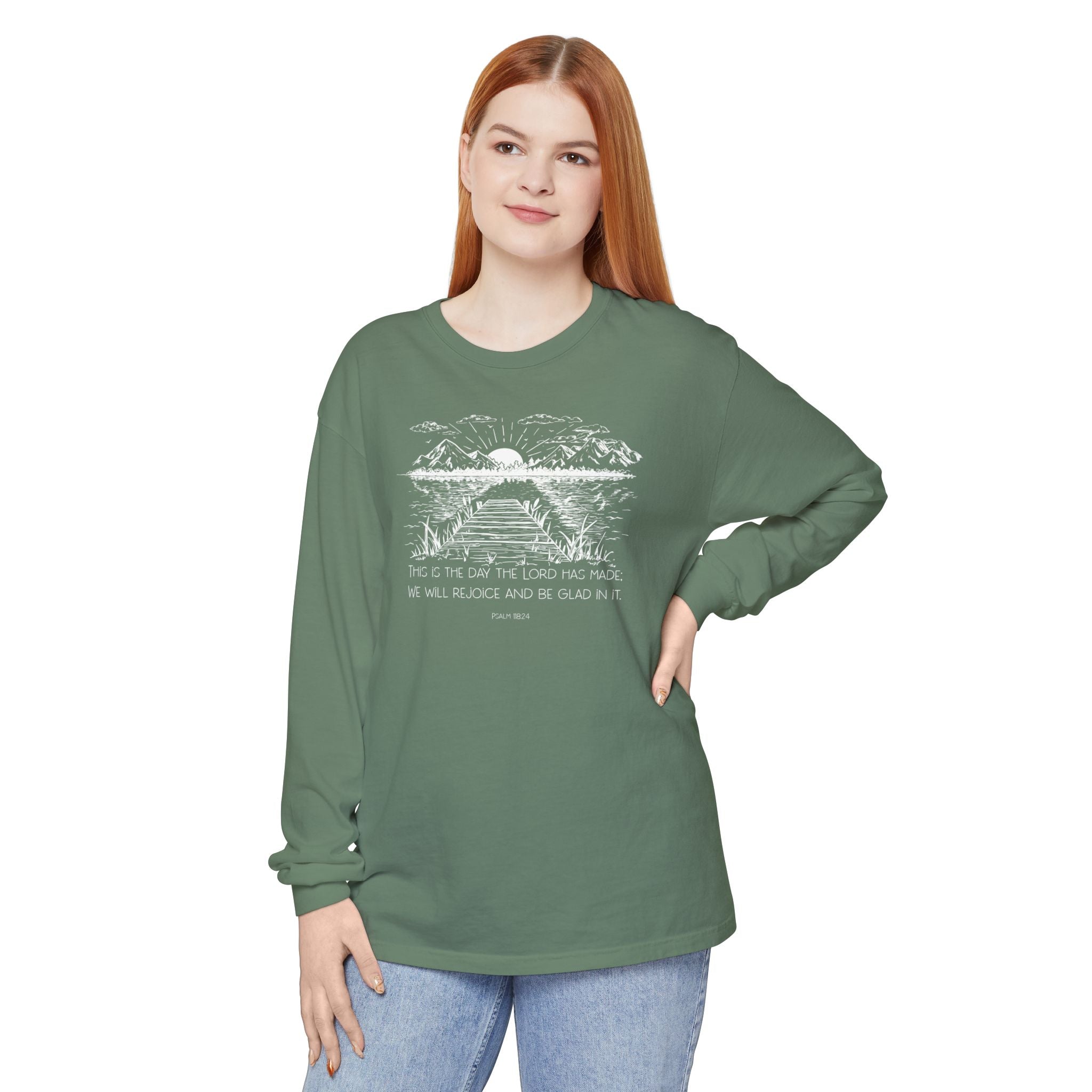 Woman wearing a long-sleeve Light Green Comfort Colors t-shirt with nature graphic and Psalm 118:24