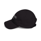 Side view of a black baseball cap