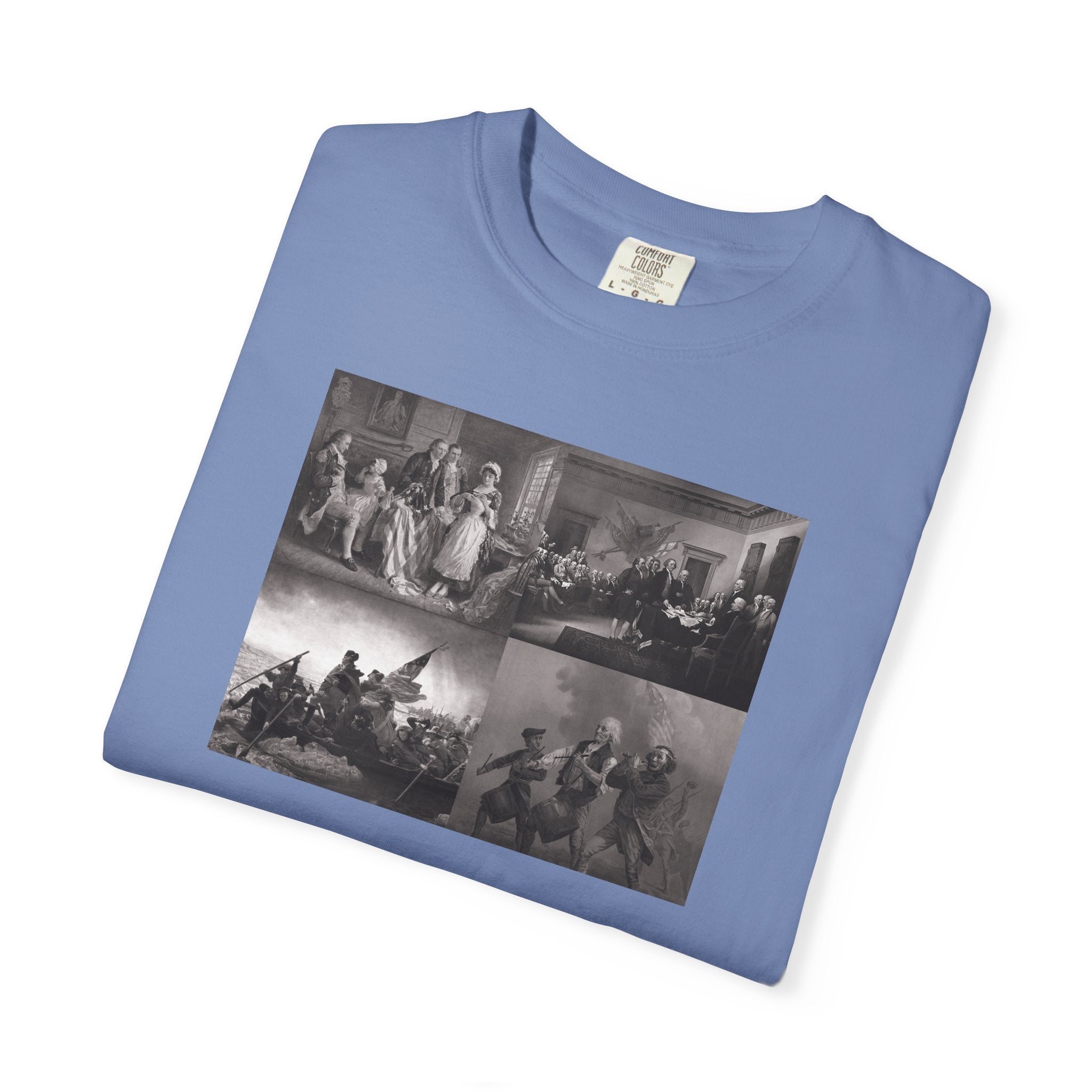 Folded Washed Denim Comfort Colors t-shirt printed with a montage of four revolutionary war era paintings