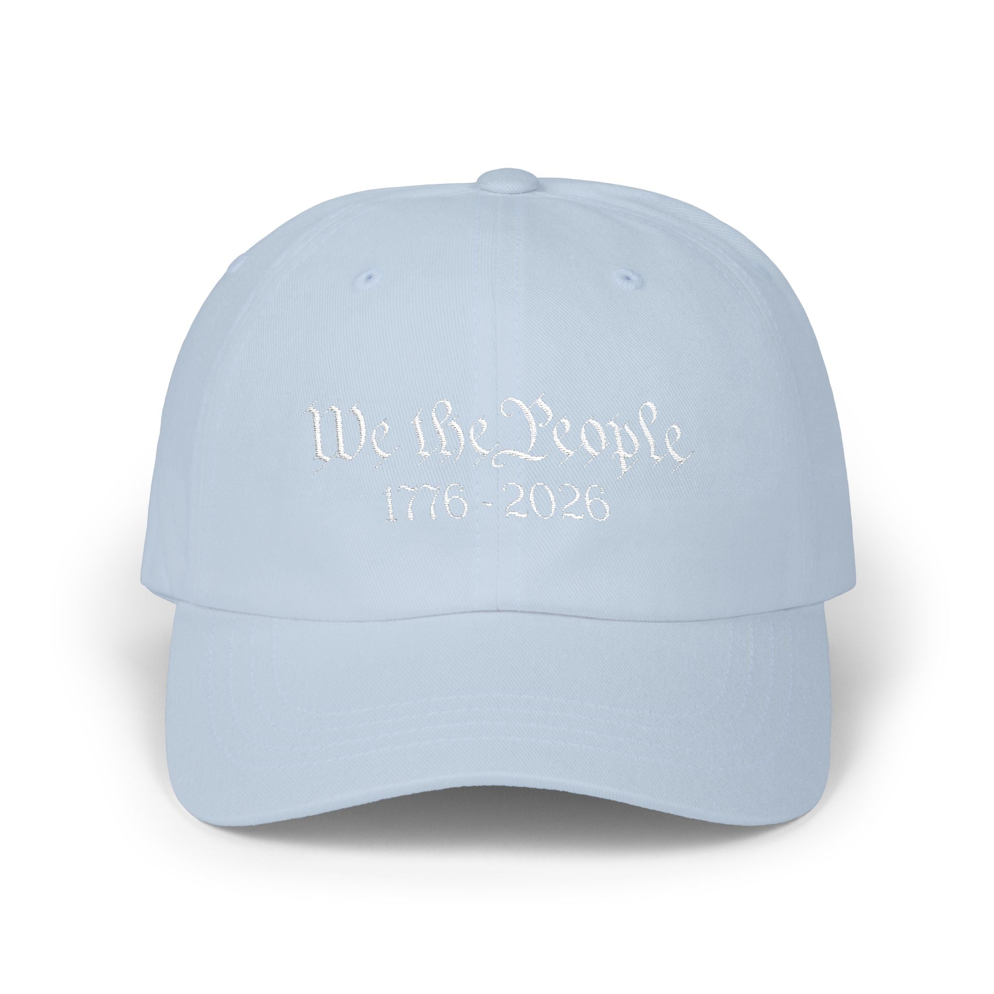 Light blue cap with embroidered 'We the People 1776-2026' against a white background