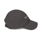 Side view of a dark grey baseball cap