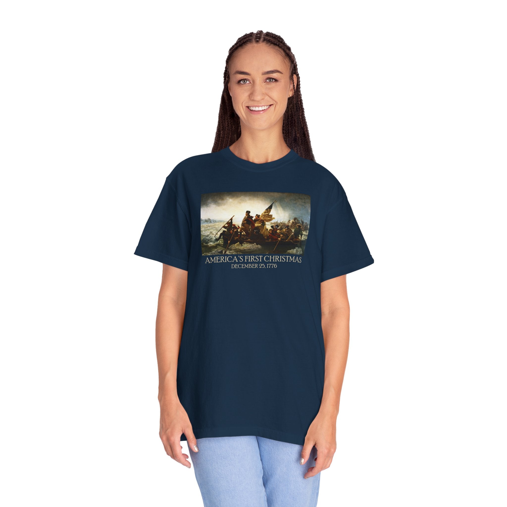 Woman wearing an oversized True Navy Comfort Colors t-shirt with print of Emanuel Leutze’s 'Washington Crossing the Delaware' with 'America's First Christmas December 25, 1776' printed below 