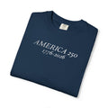 Folded True Navy Comfort Colors t-shirt with 'AMERICA 250 1776-2026' embroidered in white thread