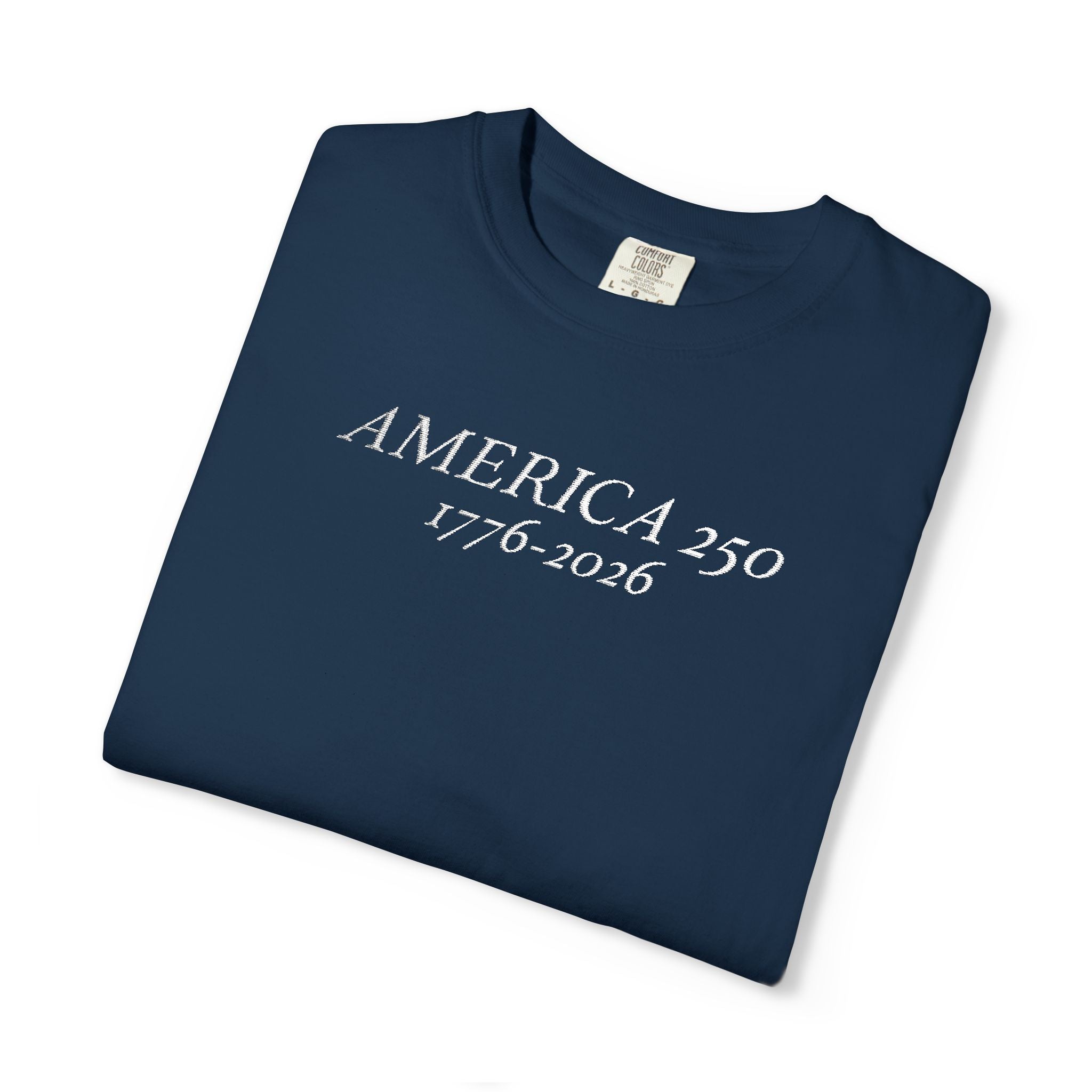 Folded True Navy Comfort Colors t-shirt with 'AMERICA 250 1776-2026' embroidered in white thread