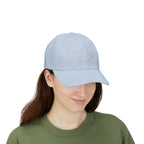 Woman wearing a light blue cap with embroidered "We the People 1776-2026" 