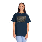 Woman wearing an oversized True Navy Comfort Colors t-shirt with a printed design of Trumbull's  'Declaration of Independence' painting with '1776-2026' in overlapping revolutionary era text