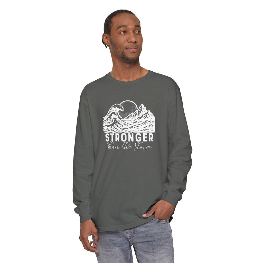 Male model in Stronger Than The Storm Christian long sleeve tee in pepper