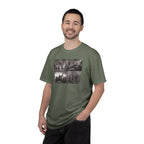 Man wearing a Moss Comfort Colors t-shirt printed with a montage of four revolutionary war era paintings