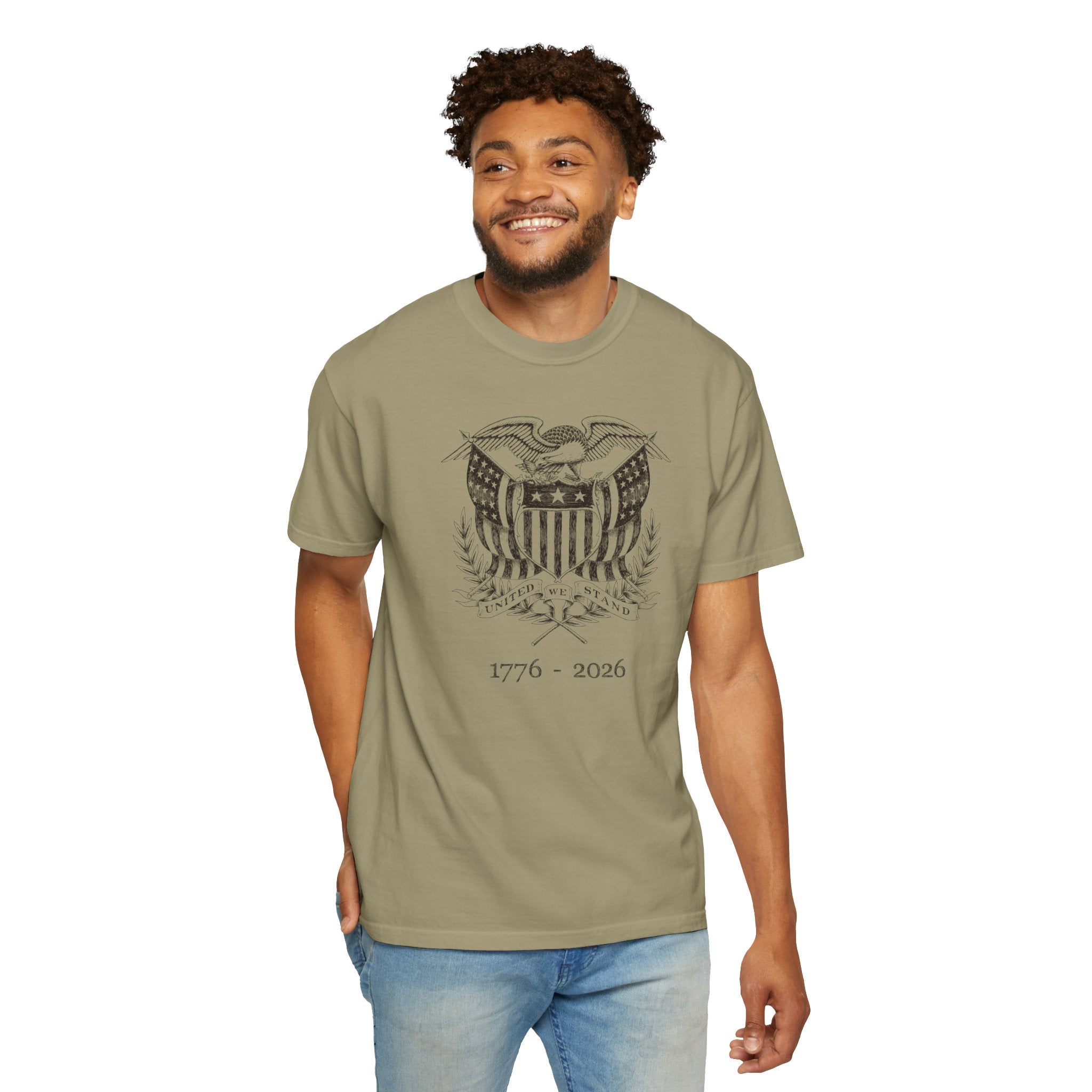Smiling man wearing a khaki United We Stand eagle t-shirt