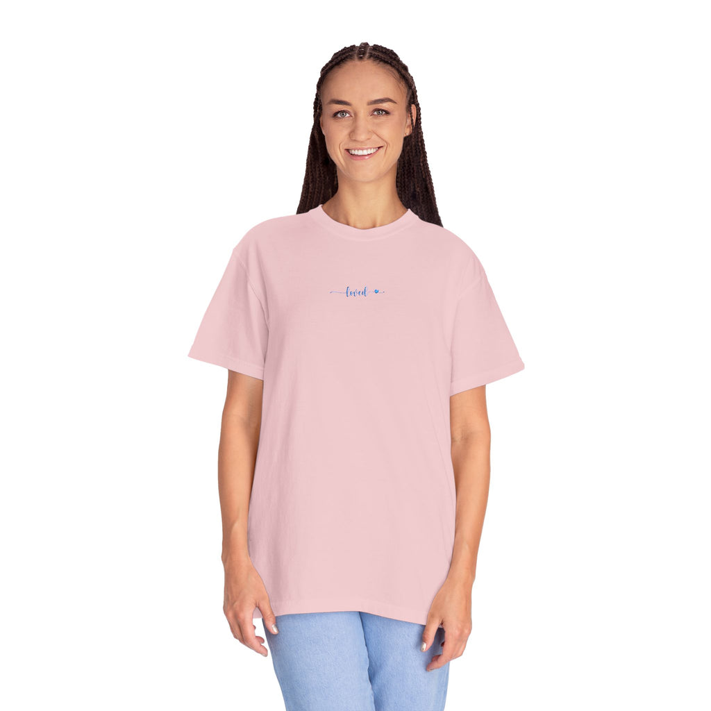 Smiling woman wearing an oversized Blossom Comfort Colors t-shirt with 'loved' embroidered in light blue thread