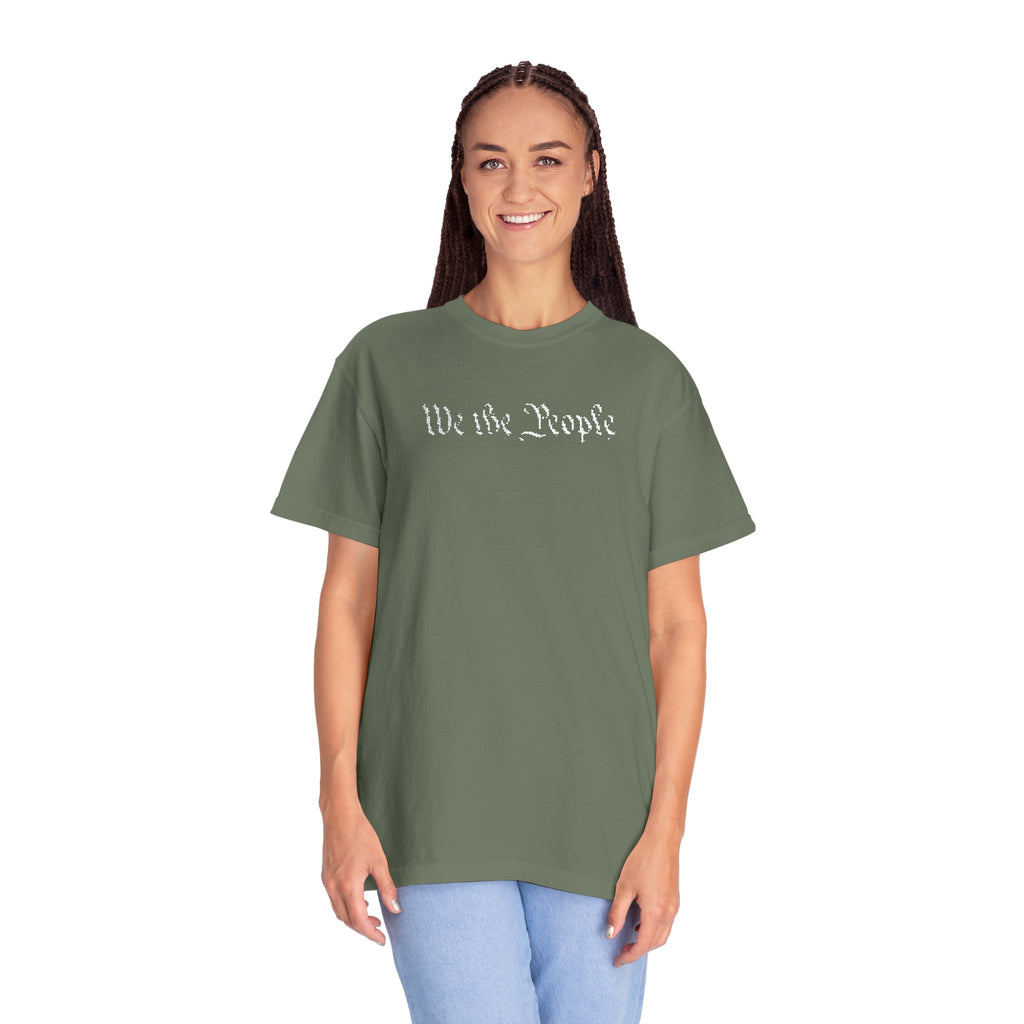 Smiling woman wearing oversized 'We the People' embroidered t-shirt in moss