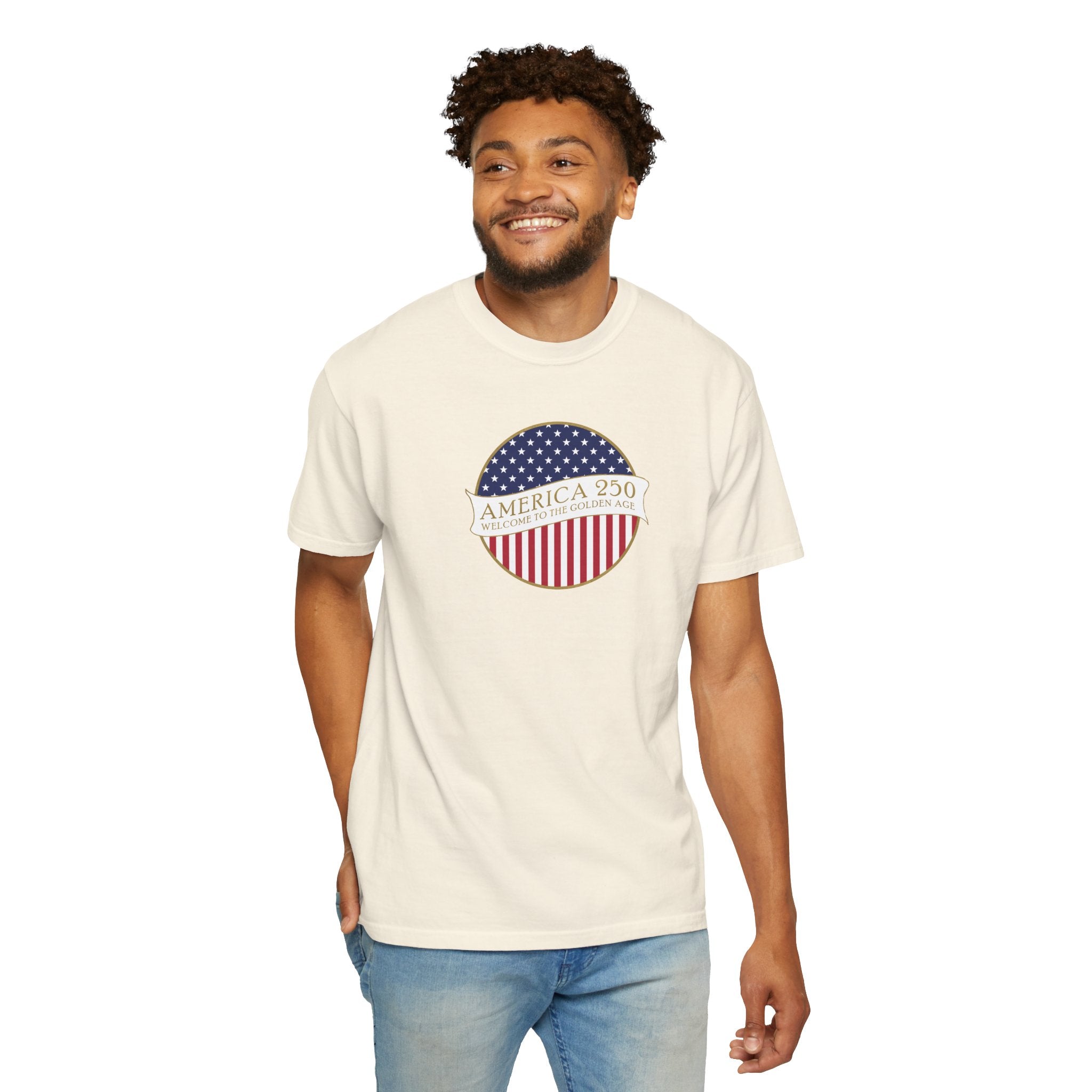 Smiling man wearing an Ivory Comfort Colors t-shirt with an America 250 design with text 'America 250 Welcome to the Golden Age'