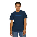 Woman wearing a True Navy Comfort Colors t-shirt embroidered with 'GOD IS GOOD' in cornflower blue thread