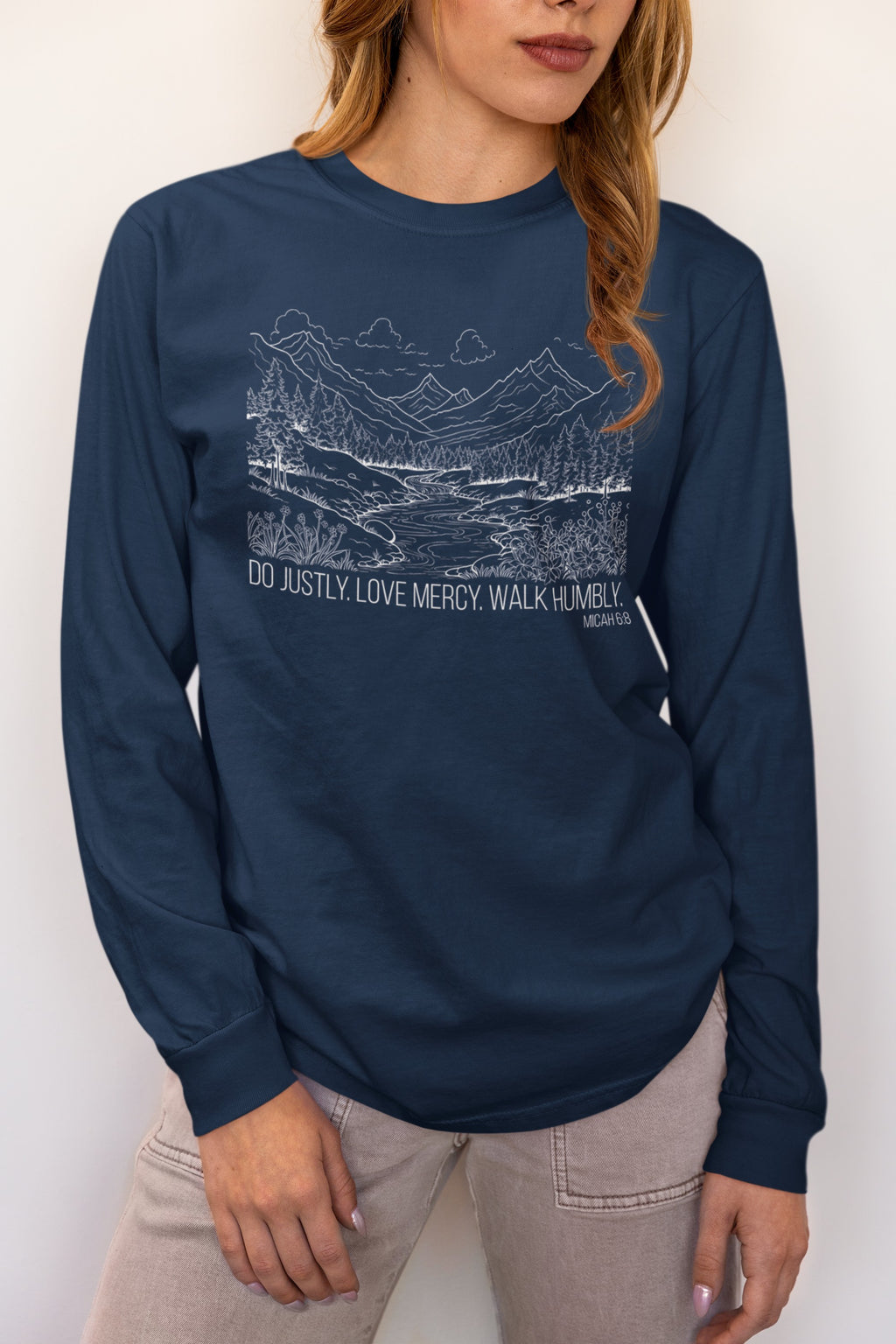 Woman wearing Micah 6:8 Christian long sleeve t-shirt in true navy