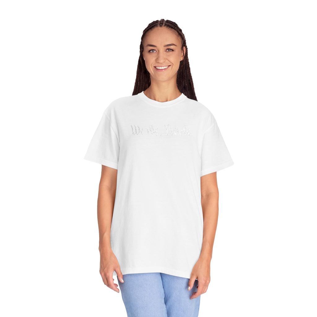 Smiling woman wearing oversized 'We the People' embroidered t-shirt in white