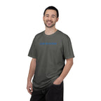 Smiling man wearing a Pepper Comfort Colors t-shirt with 'GOD IS GOOD' embroidered in cornflower blue thread