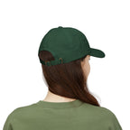 Back view of a woman wearing a spruce green cap
