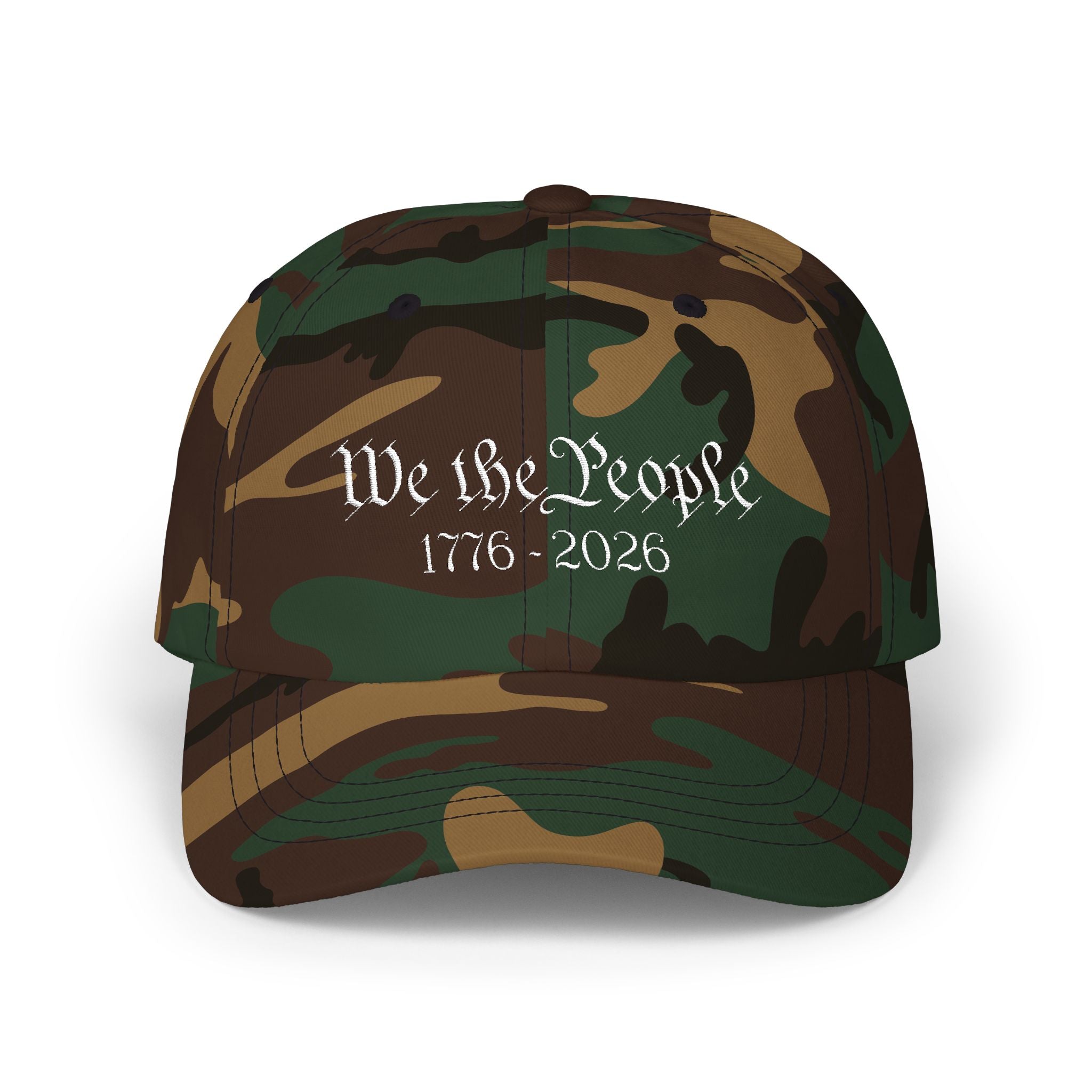 Green Camo cap with embroidered 'We the People 1776-2026' against a white background