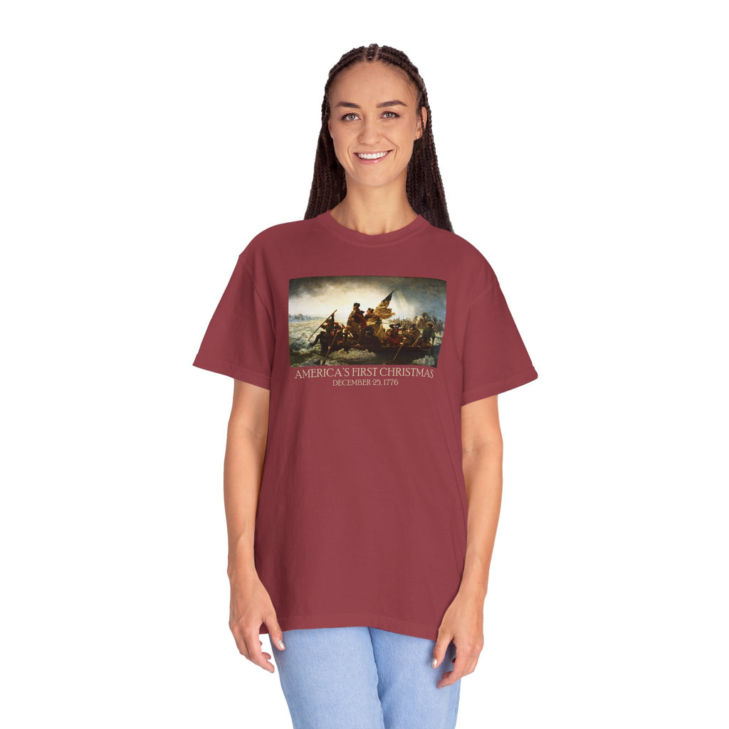 Woman wearing an oversized Chili Comfort Colors t-shirt with print of Emanuel Leutze’s 'Washington Crossing the Delaware' with 'America's First Christmas December 25, 1776' printed below 