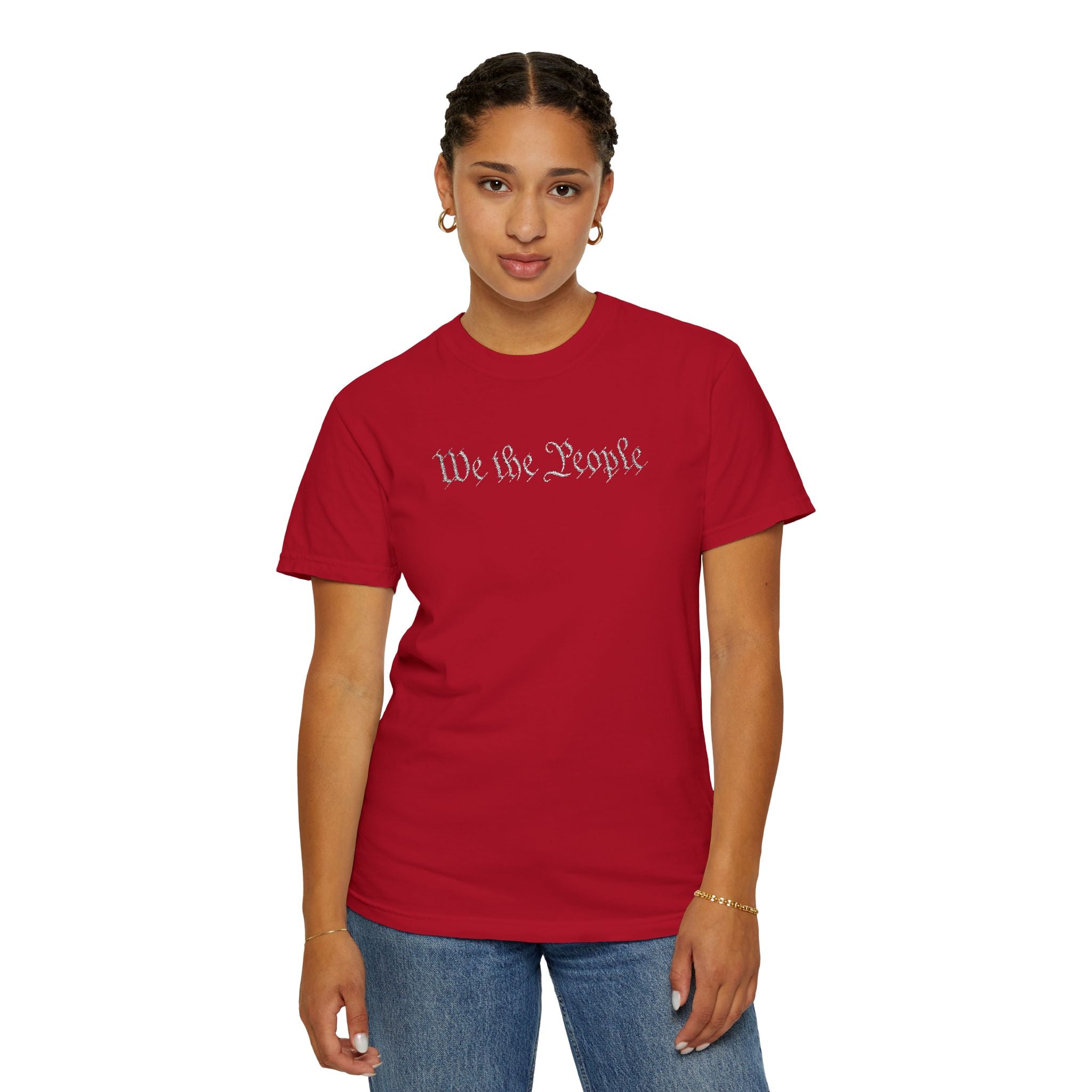 Woman wearing 'We the People' embroidered t-shirt in red