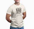 Man wearing an ivory United We Stand eagle t-shirt