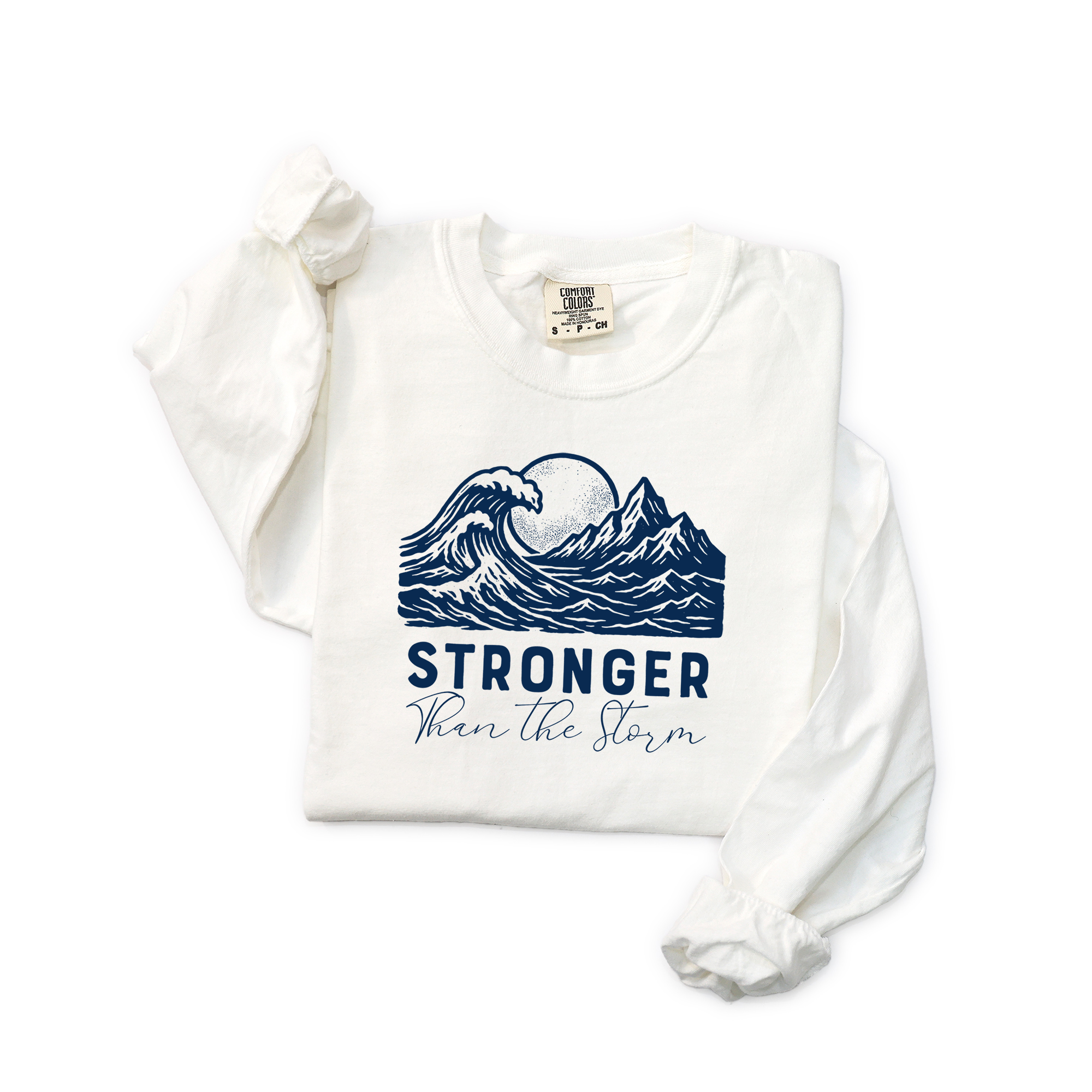 Folded Stronger Than The Storm Christian long sleeve t-shirt in white, mountain wave sun design with faith-inspired message 