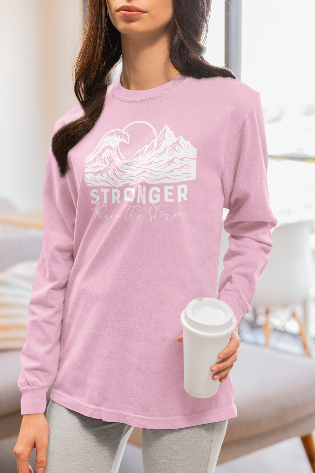 Model wearing Stronger Than The Storm Christian long sleeve tee in blossom