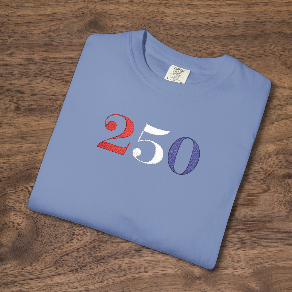 America 250 embroidered t-shirt with big bold 250 in red white blue thread on washed denim tee, patriotic design